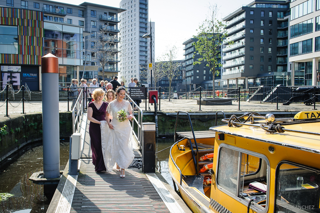 Wedding party taking a water taxi at Clarence Dock leeds