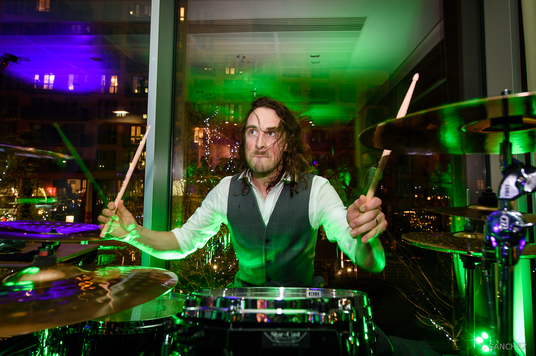 Groom playing the drums at a wedding in Doubletree by Hilton Leeds